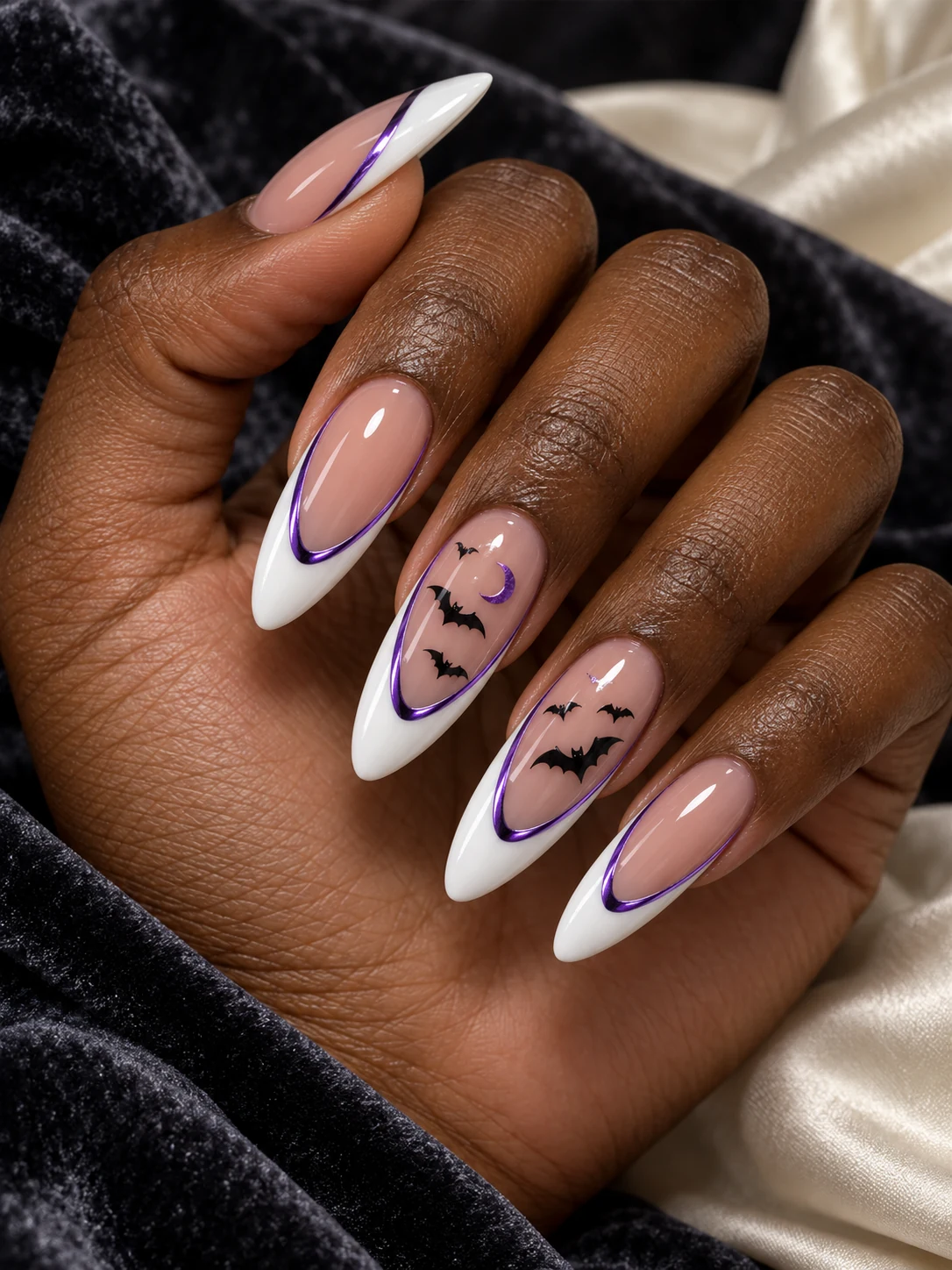 White deep French tips with violet chrome outlines, black bats and crescent moons