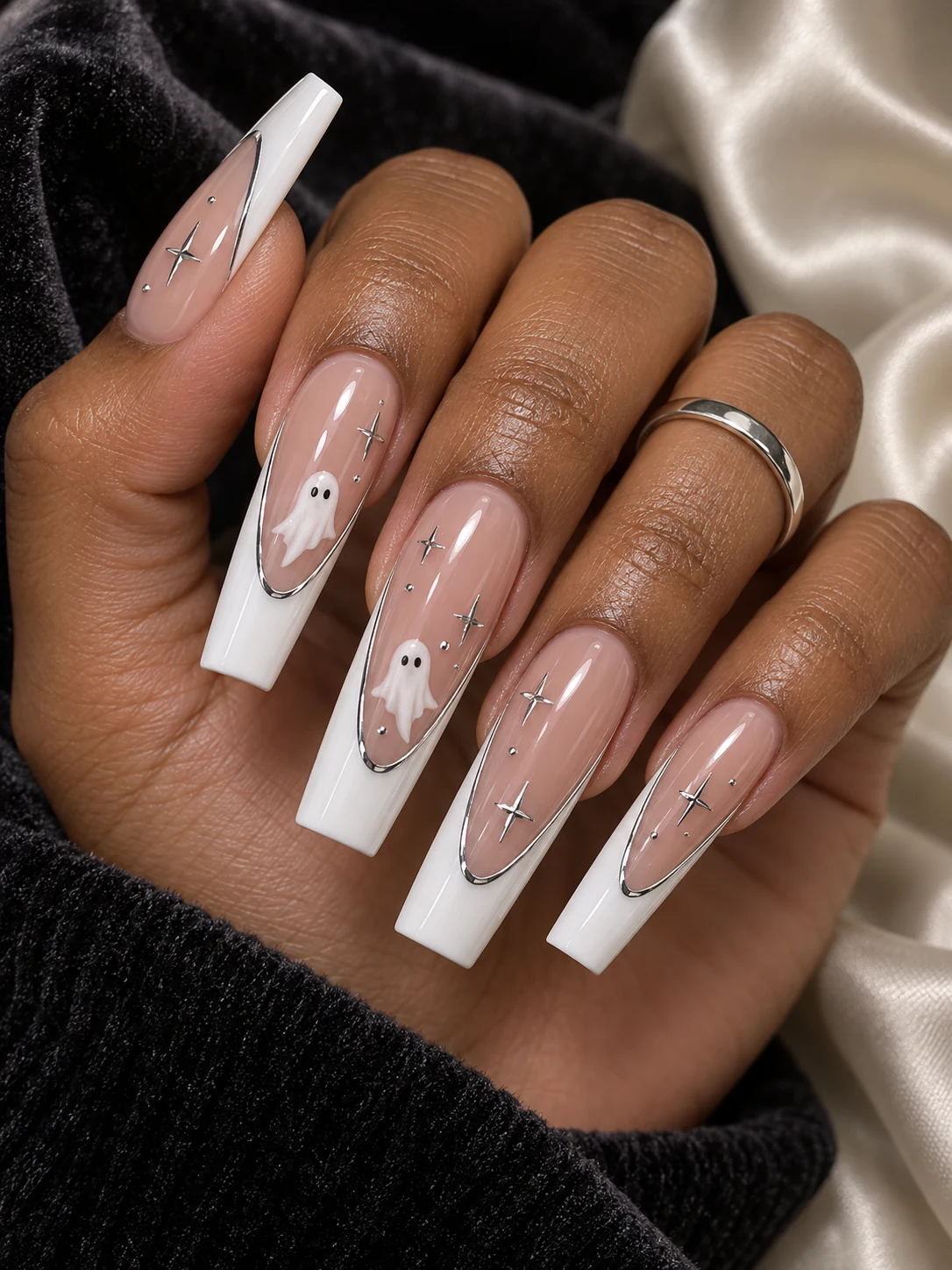 White dramatic deep French with silver chrome outlines, tiny ghosts and silver stars